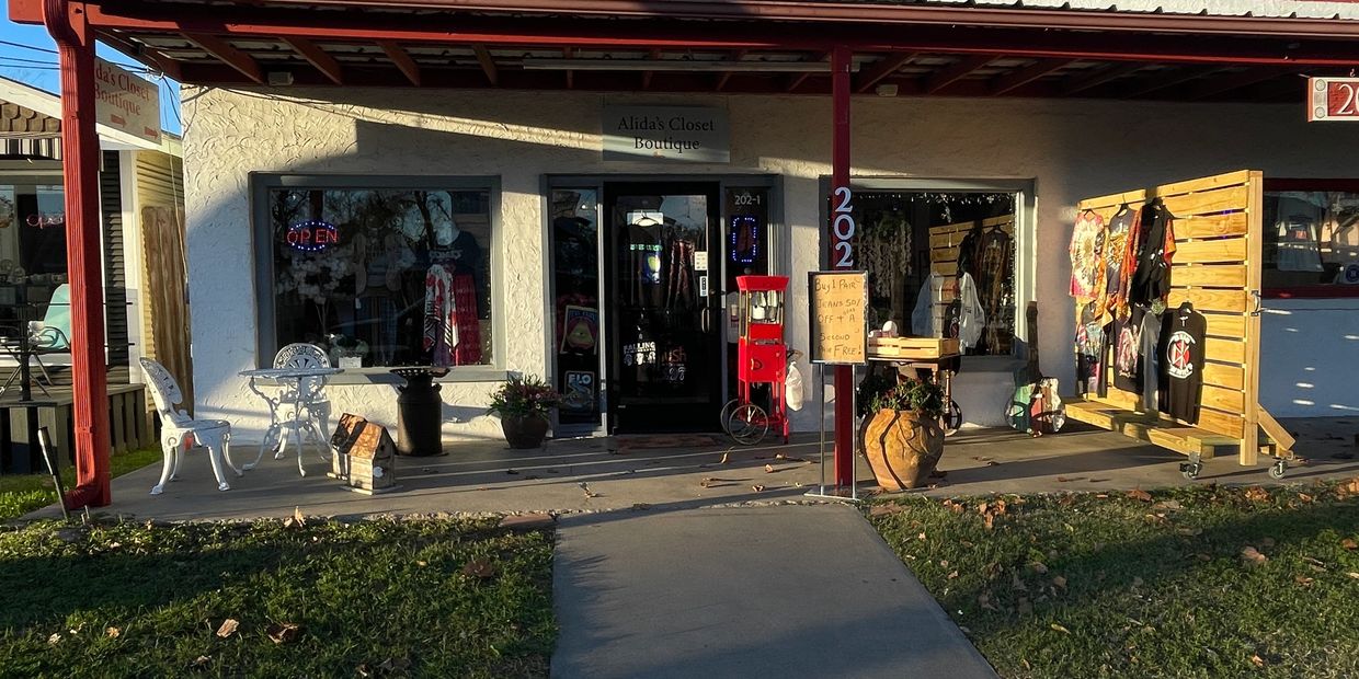 A serene landscape featuring rolling hills, a clear blue sky, and a tranquil lake reflecting the surroundings.