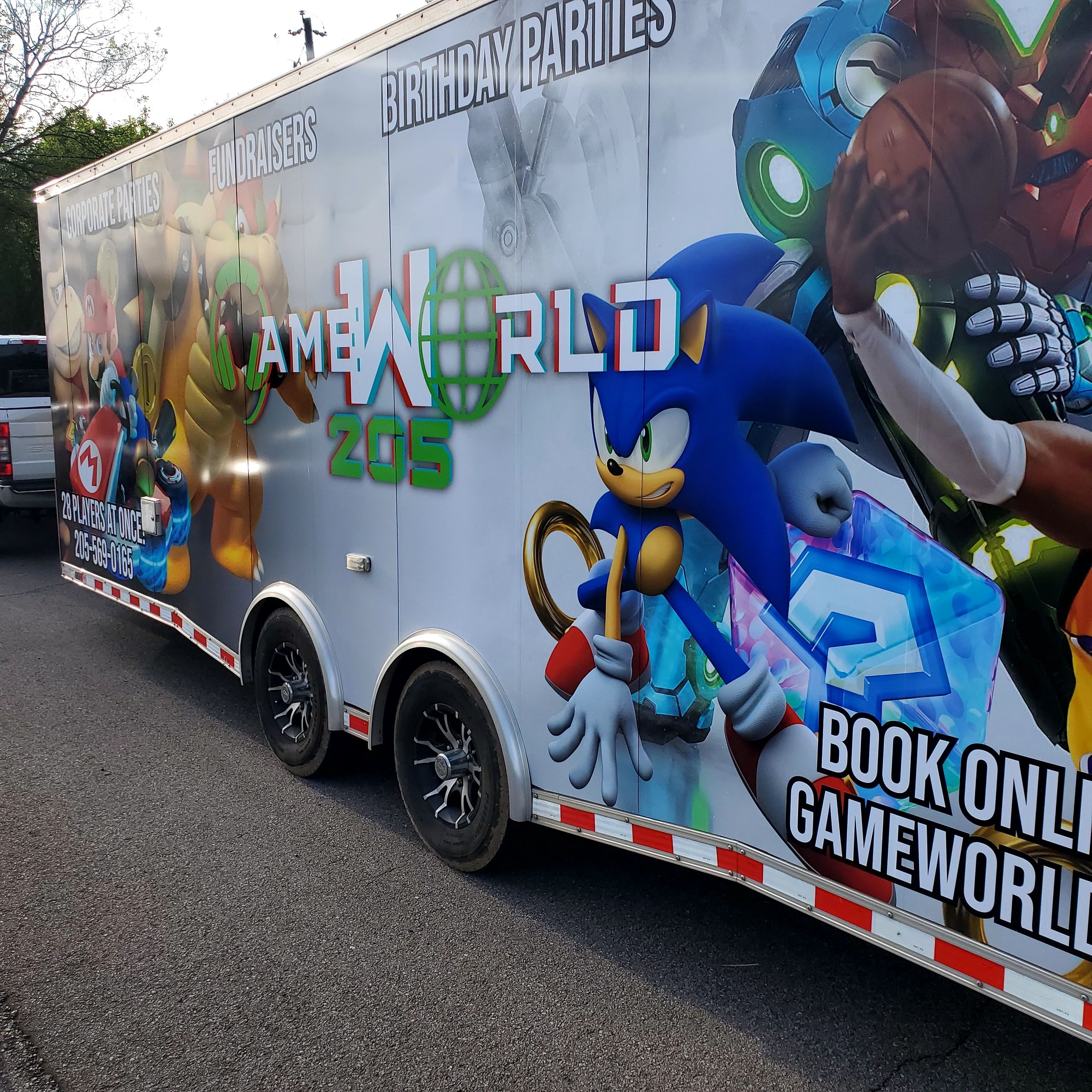 Gaming-themed trailer advertising party and fundraiser services with popular characters like Sonic and Mario.
