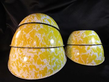 This listing is for a set of FIVE yellow granite and enamelware nesting or mixing bowls.  It has a s