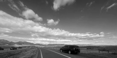 Luxury SUV driving to Boulder CO