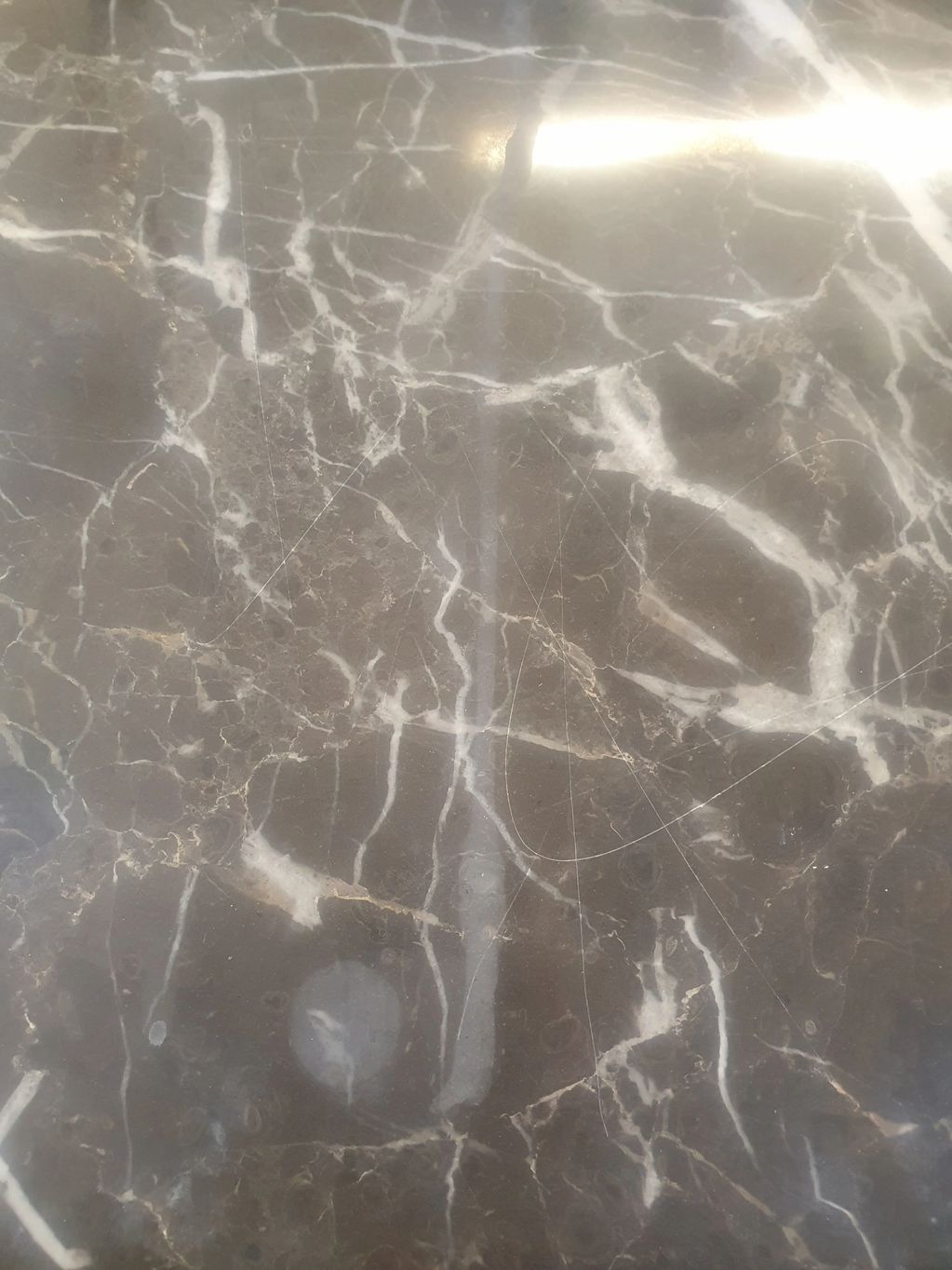 Marble with etch marks on ( before)