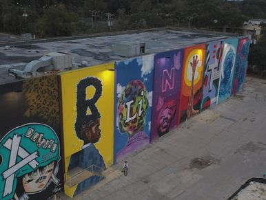 Colorful mural spelling 'RELATION'.