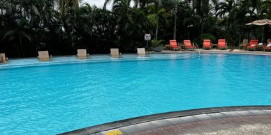 Pool-side recliners at Marco Polo Plaza Hotel