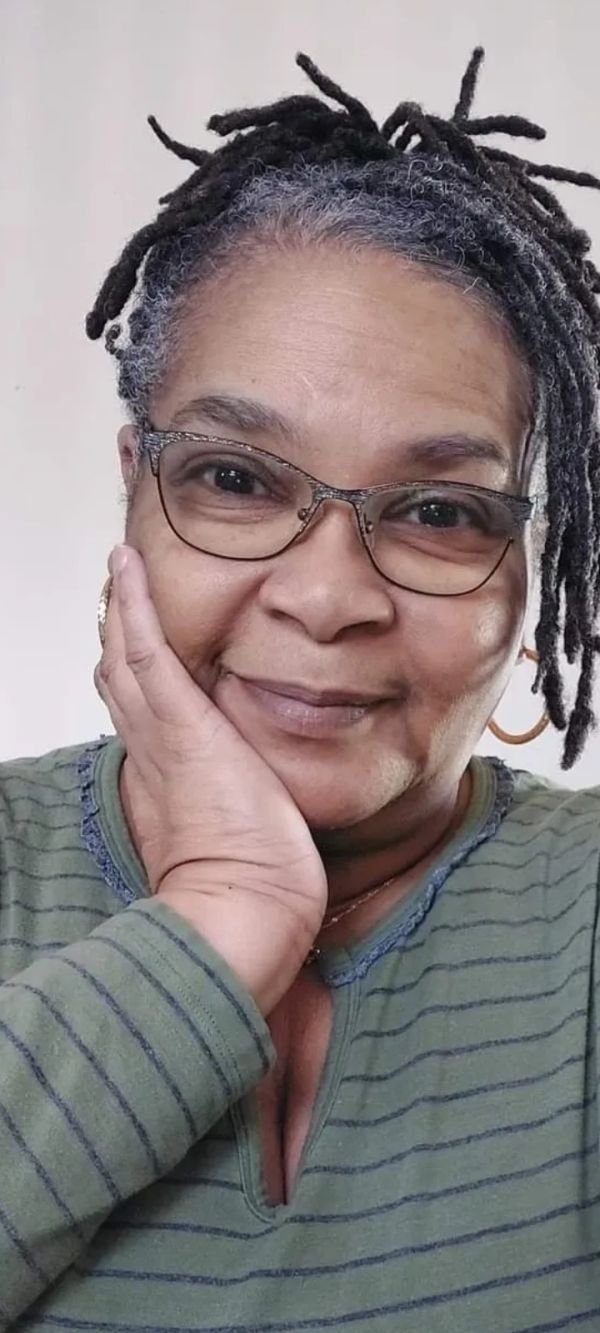 Woman smiling gently.