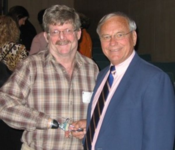 Jeff shakes hands with Harry Mitchell, 
​one of his high school teachers