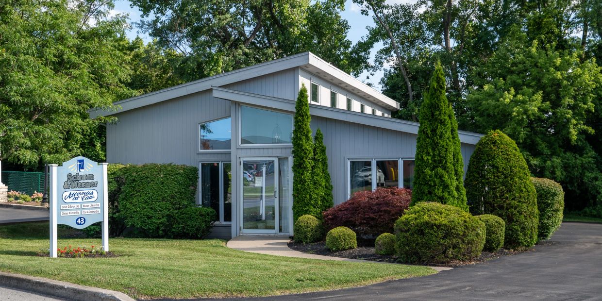 Modern law office building with well-kept landscaping.