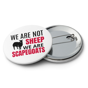 Button pin stating 'We are not sheep, we are scapegoats' with a sheep graphic.