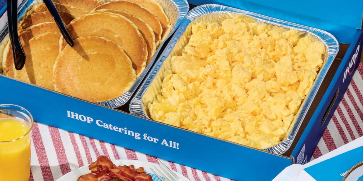 IHOP Winnipeg and Alberta catering box with pancakes, fruits and scrambled eggs. 