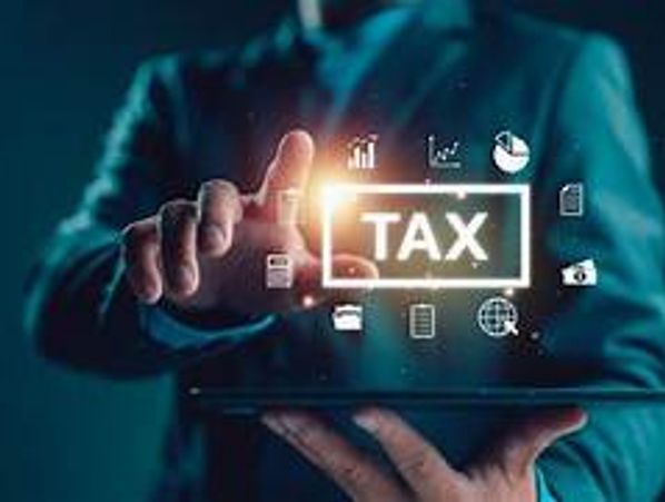 Businessman interacting with digital tax icons on a tablet.