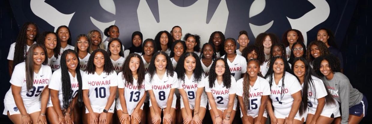Howard women's basketball team poses together in uniform.