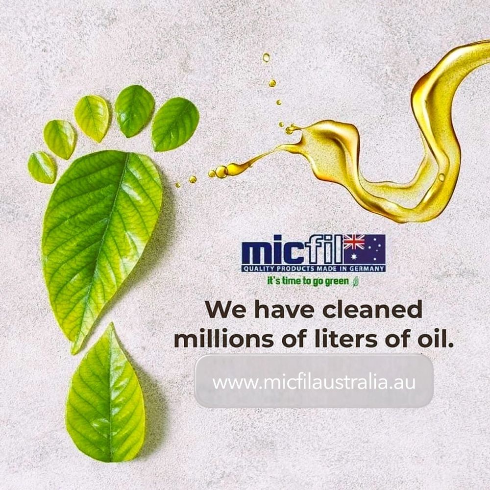 Green leaf footprint with oil splash promoting eco-friendly oil cleaning.