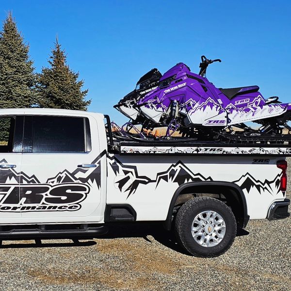 Custom designed sled wraps with a custom design vehicle wrap. 