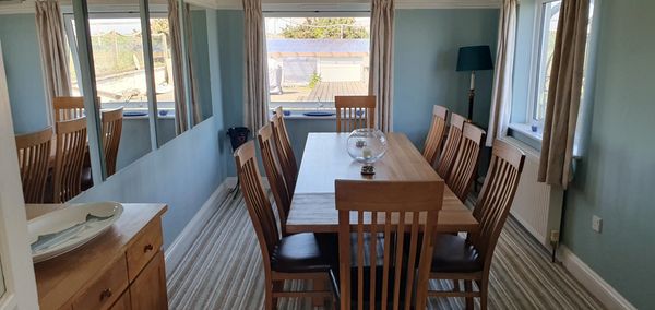 Dining room with views onto the back garden and sea