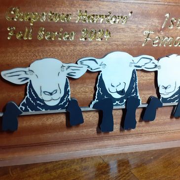 Wooden award plaque with sheep figures for 1st Female in Chepstow Harriers Fell Series 2024.