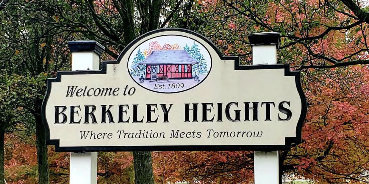 Welcome sign for Berkeley Heights with autumn trees in the background.