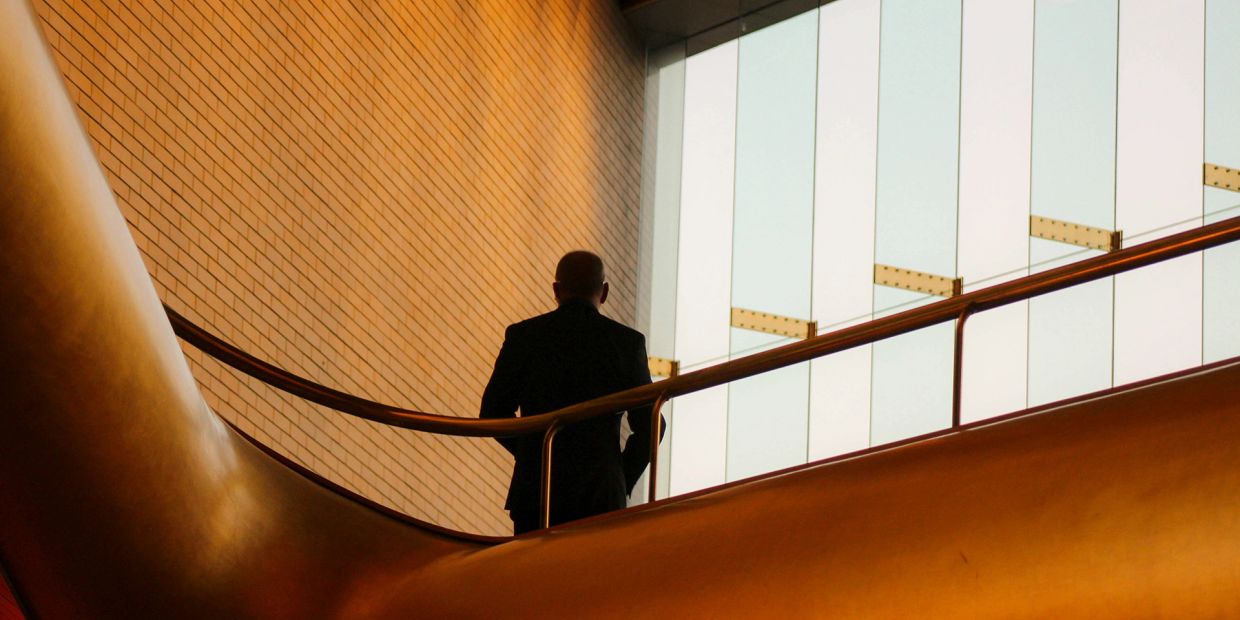 Businessman in office looking toward window