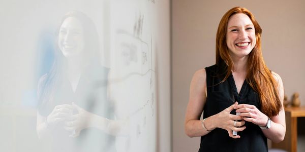 Woman smiling while presenting