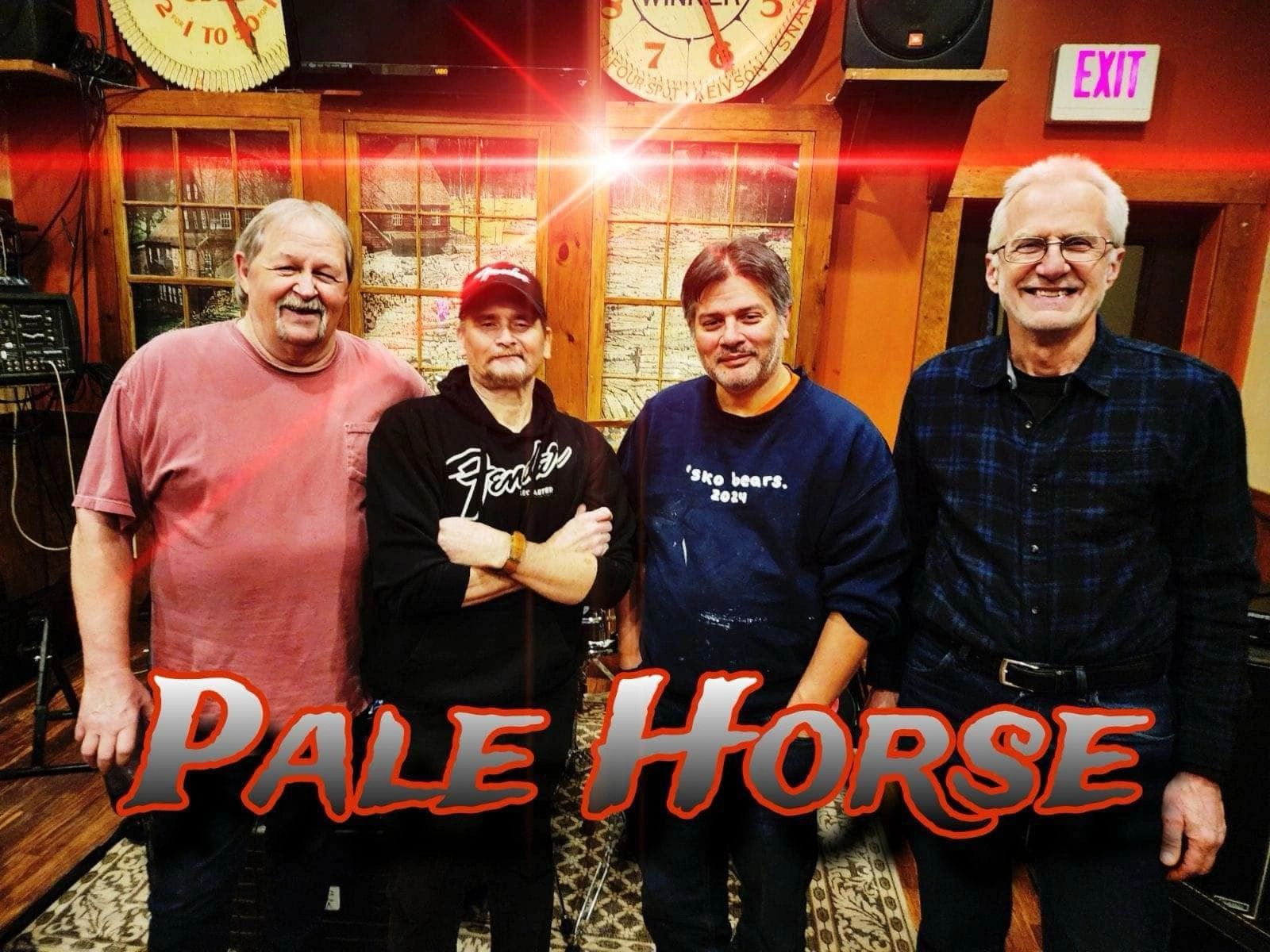 Four men posing indoors with the words 'Pale Horse' in bold text.