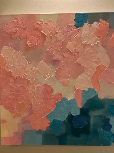 Abstract painting with textured pink and blue shapes on a muted background.