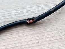 Damaged electrical power cord for in-patient hospital bed or operating table
