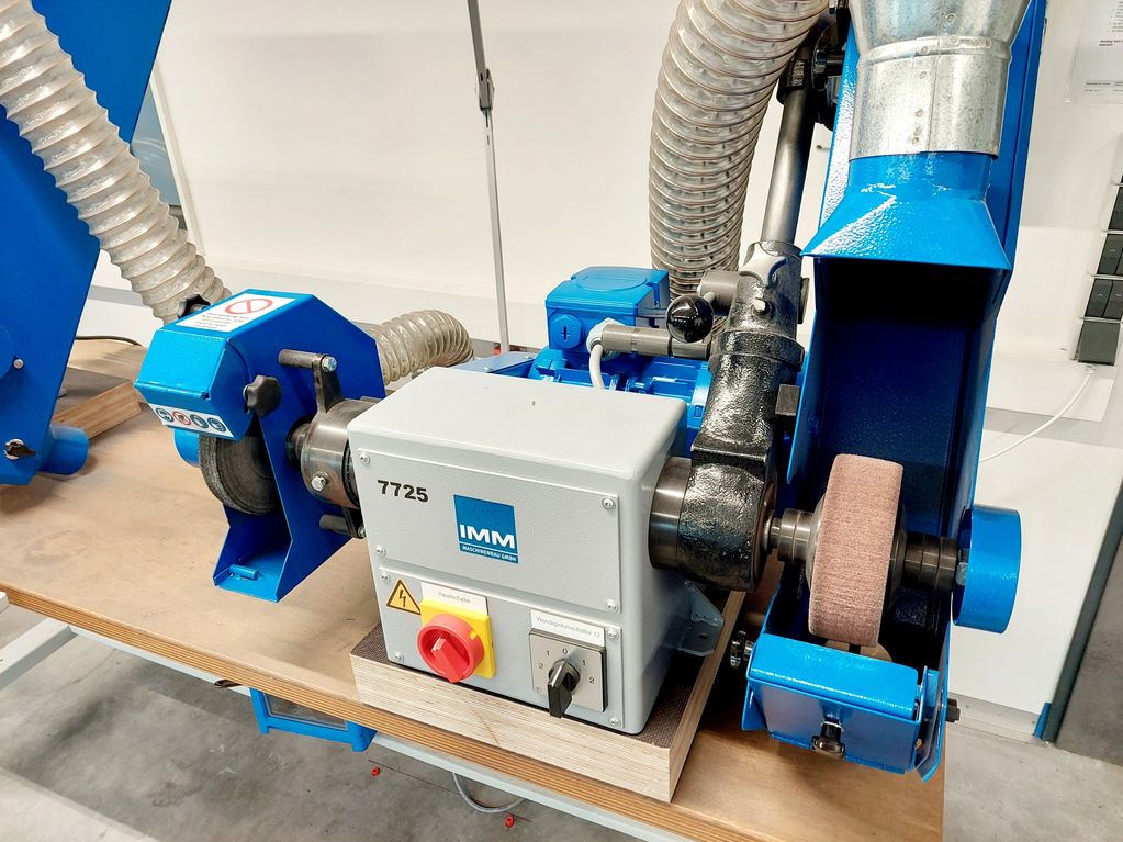 Work bench mounted IMM belt grinding and polishing machine.