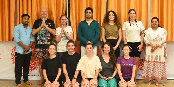 Student posing after yoga teacher training with yoga teachers at Best yoga school in Rishikesh