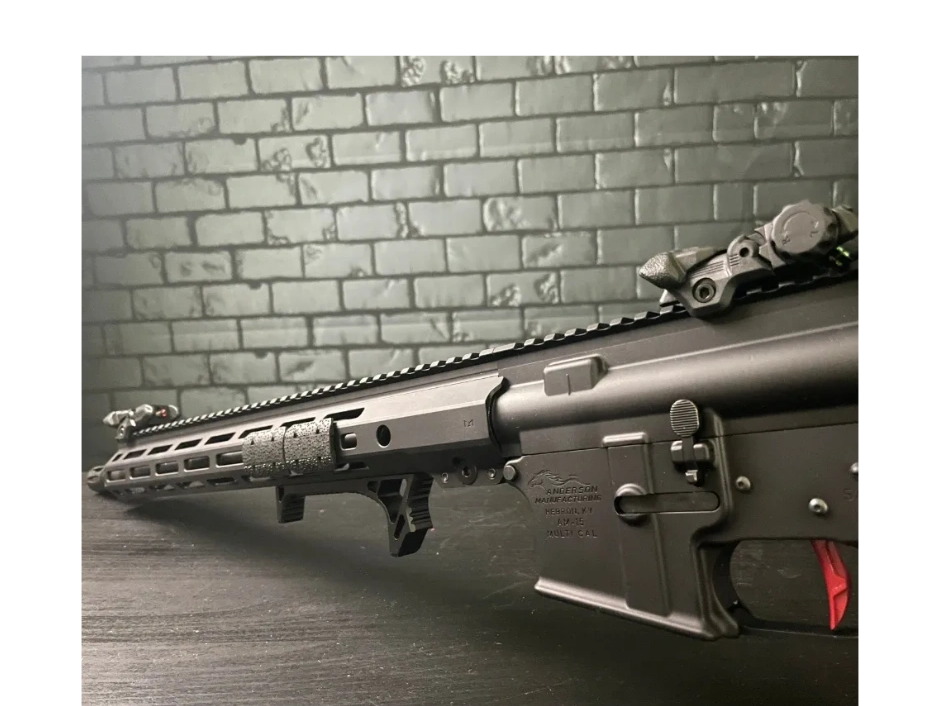 Black AndersonManufacturing's Frontline Series 16” AR-15 Rifle chambered in 5.56. With red trigger