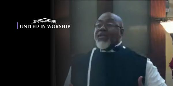 A man passionately speaking during a worship service.