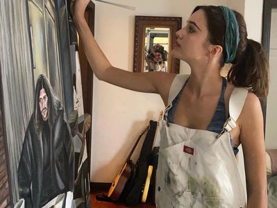 Ruby Sear Painting in her studio.