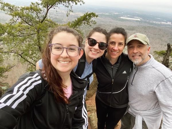 From left: My daughters Lauren & Lindsay, myself, & my partner, Tim.