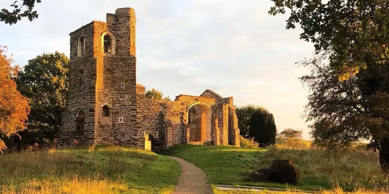Ancient stone ruins bathed in golden sunlight.