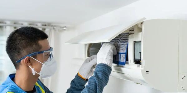 certified mold inspector assessing air filter 