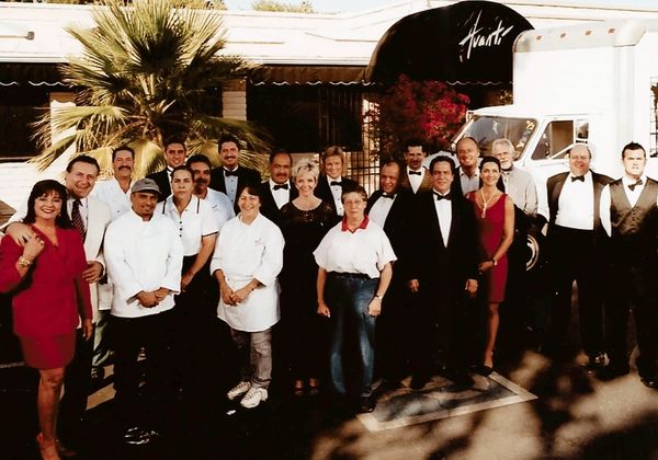 avanti az staff and owner standing in front of the restaurant