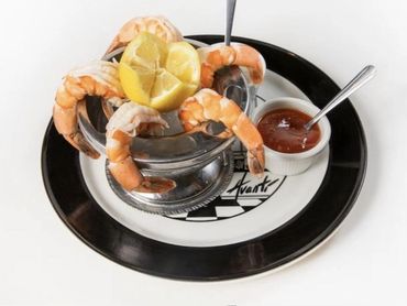 Jumbo shrimp cocktail with lemon on the Avanti plate