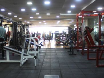 Interior view of a gym with various exercise equipment.