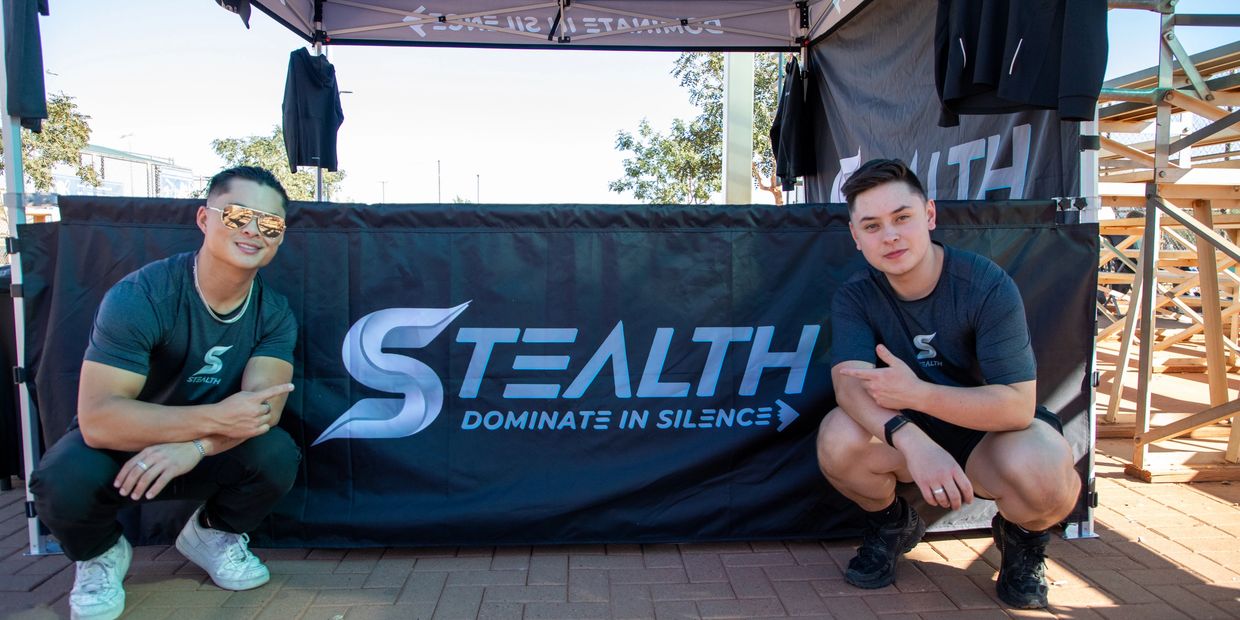 A two man sit on the floor withLooking on the camera