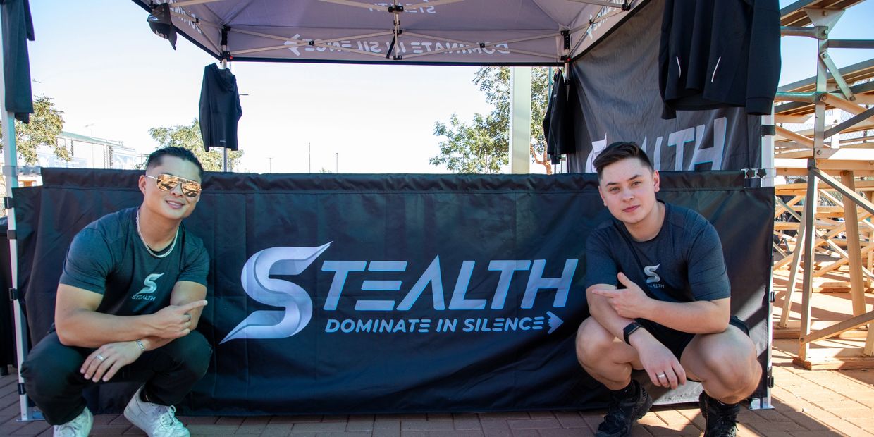 A two man sit on the floor withLooking on the camera