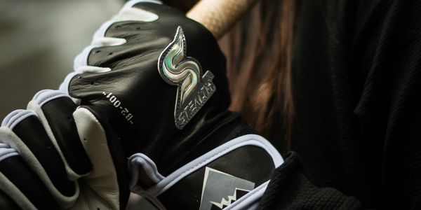 A man hold the baseball bat on the hand