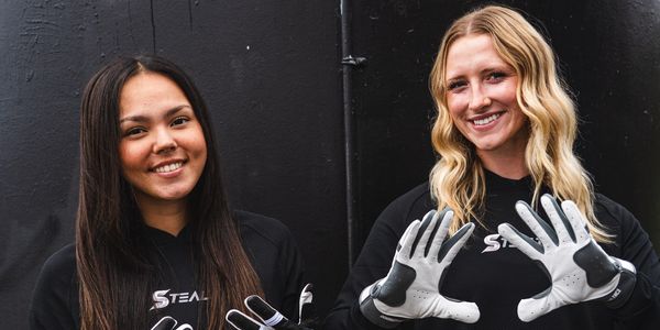 A two woman smiling with Sowing handcuffs