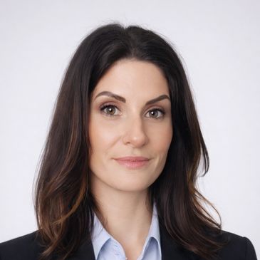 Professional woman with dark hair and a slight smile.