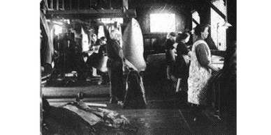 A black & white photograph image of workers in a boot factory in Mabole, Ayrshire.