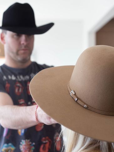 Custom fitting your selected western style hat. Finding the centre of the crown with your head/face.