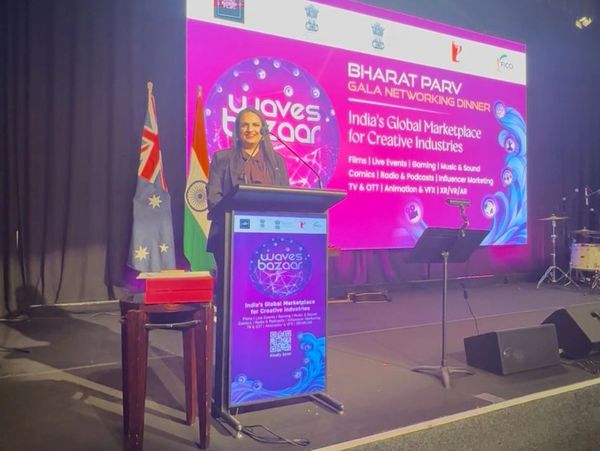 A woman speaks at the Bharat Parv Gala Networking Dinner promoting India's creative industries.