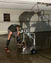 Removing wipes from a clogged sewer in Santa Monica