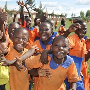 Build Africa students playing outside of their school