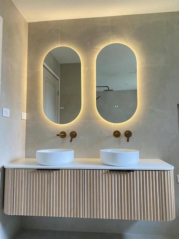 Cassa Design V-Groove Curved Double Bowl Wall Hung Vanity with Touchless Oval Led Mirror.