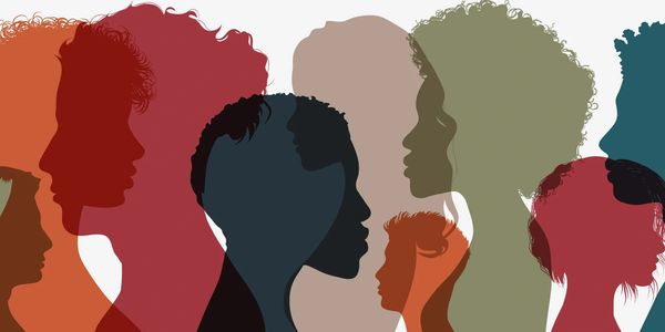 Colorful overlapping silhouettes of diverse human profiles.