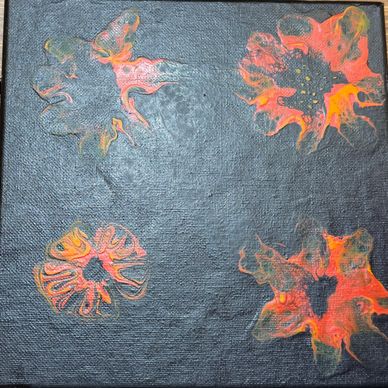 Abstract flowers in fiery orange and red on a dark canvas.
