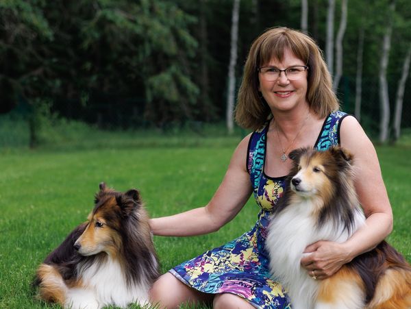 Synergy's president, Debby Beck relaxing at home with her special furry friends Lexi and Bose