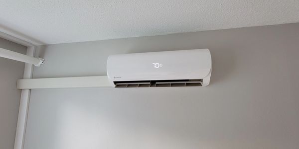 Ductless Air System installed on a wall inside of a home.